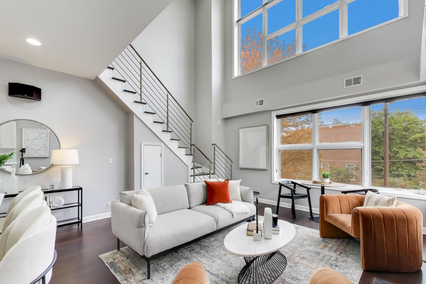 932 North Racine Avenue, Unit 2S Chicago, IL 60642 - Photo 7 of 29 a living room with furniture and a large window