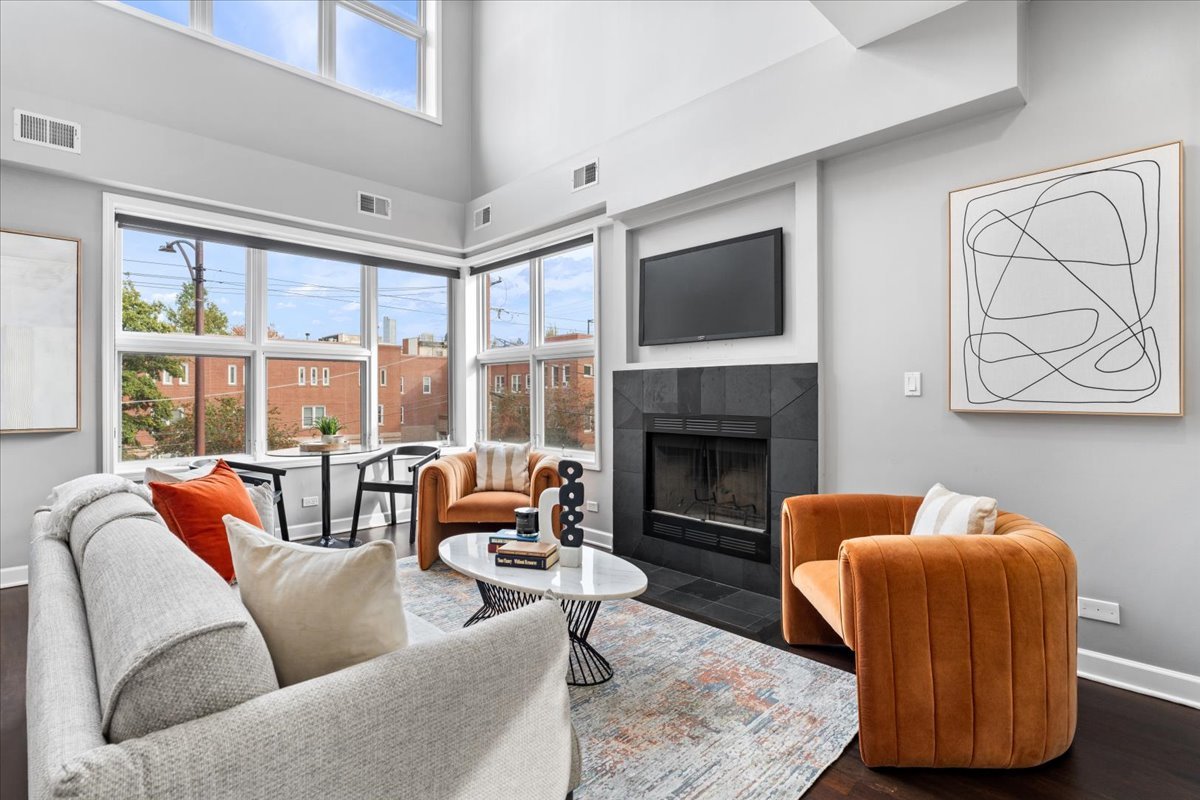 932 North Racine Avenue, Unit 2S Chicago, IL 60642 - Photo 8 of 29 a living room with furniture and a fireplace
