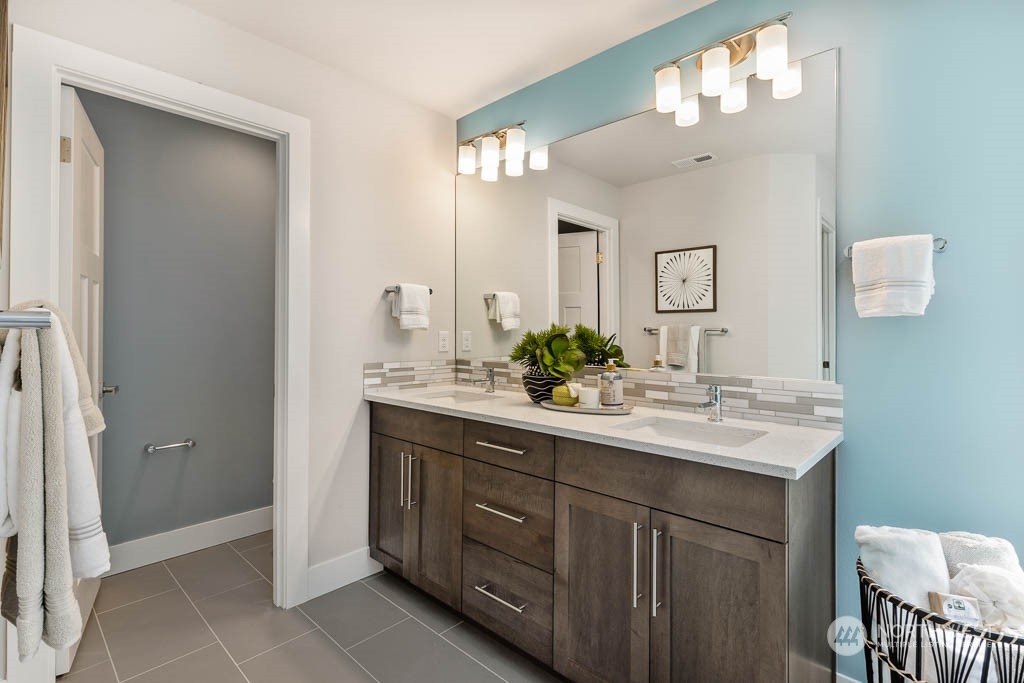 19 177th St S West Bothell, WA 98012 - Photo 19 of 29 a bathroom with a double vanity sink and a mirror
