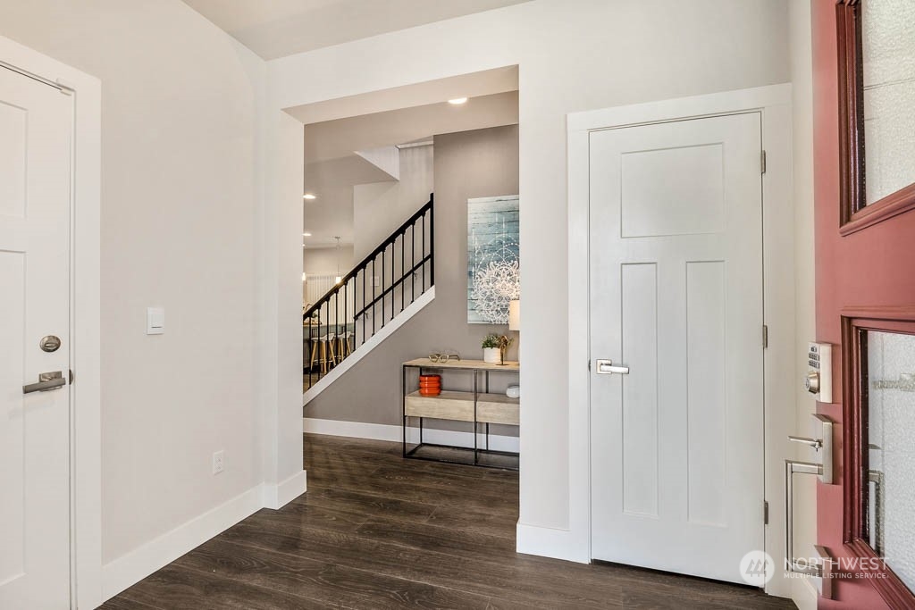 19 177th St S West Bothell, WA 98012 - Photo 2 of 29 a view of a hallway with wooden floor and entryway