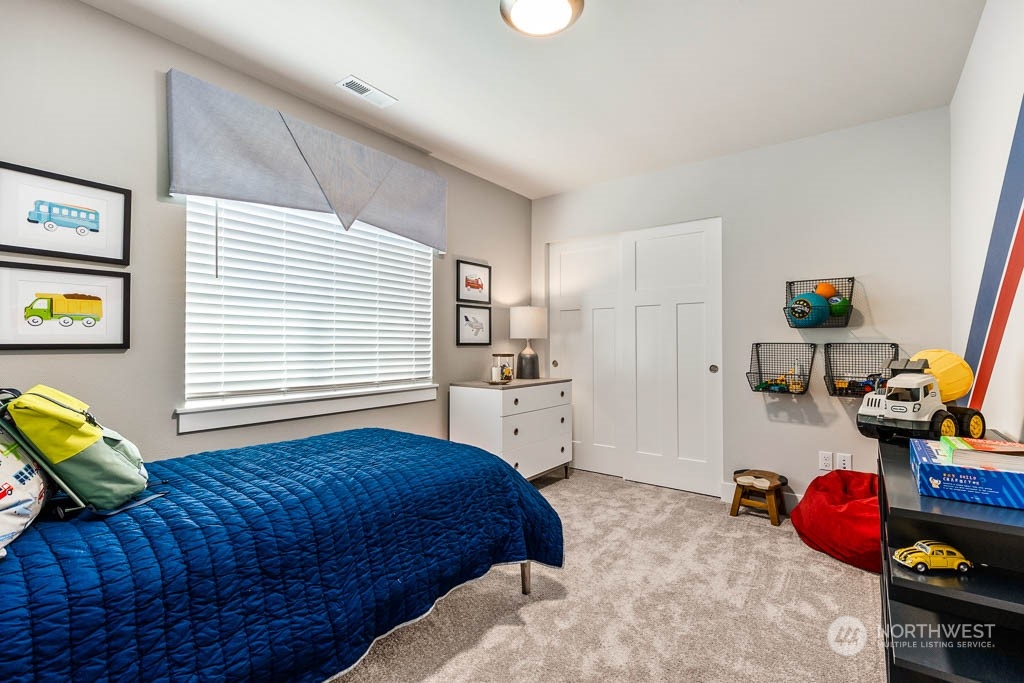 19 177th St S West Bothell, WA 98012 - Photo 23 of 29 a bedroom with a bed and a window