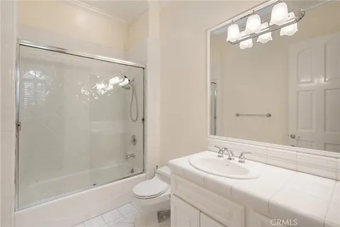 a view of a swimming pool with a table and chairs