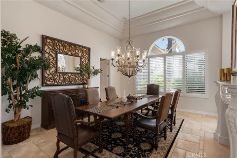a bathroom with a granite countertop sink a mirror and shower