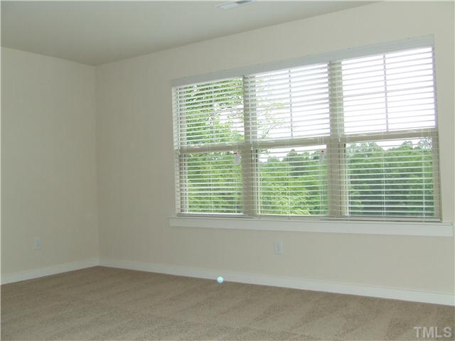 7803 Lillyhurst Drive Raleigh, NC 27612 - Photo 11 of 25 a view of an empty room with a window