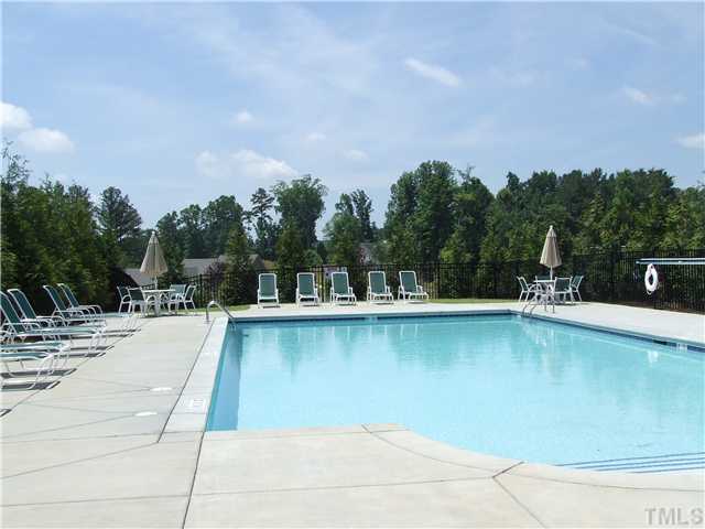 7803 Lillyhurst Drive Raleigh, NC 27612 - Photo 13 of 25 a view of a swimming pool and lounge chair