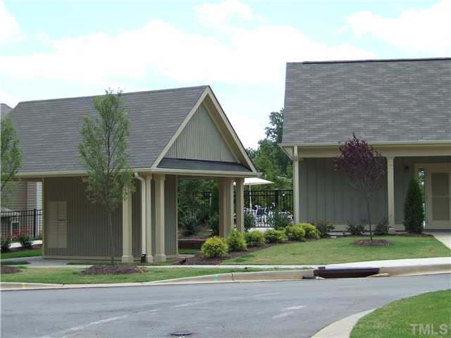 7803 Lillyhurst Drive Raleigh, NC 27612 - Photo 16 of 25 a front view of a house with a yard