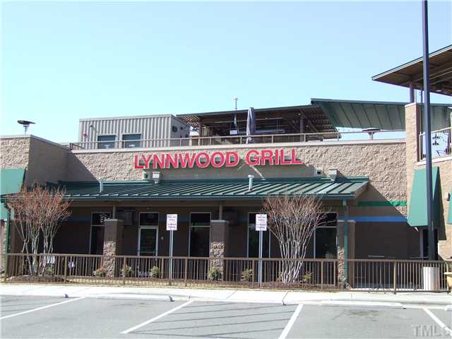 7803 Lillyhurst Drive Raleigh, NC 27612 - Photo 17 of 25 a view of a building with retail shops