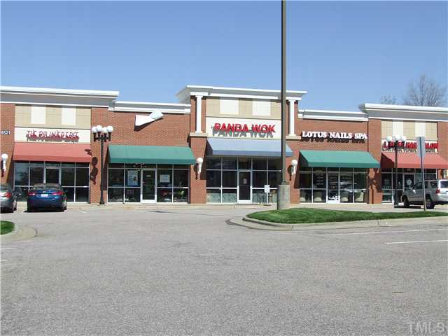 7803 Lillyhurst Drive Raleigh, NC 27612 - Photo 19 of 25 a view of a building with a street