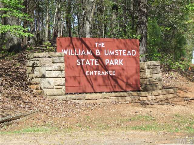 7803 Lillyhurst Drive Raleigh, NC 27612 - Photo 20 of 25 a sign on the side of the road