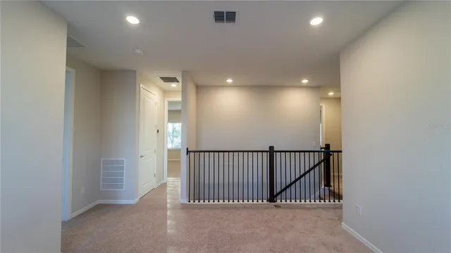 a view of hallway with windows