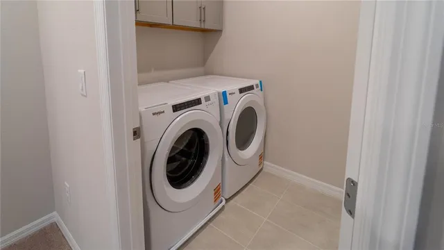 a view of an empty room and a window