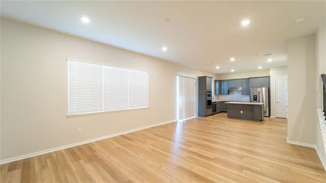 a view of a kitchen with a sink and cabinets