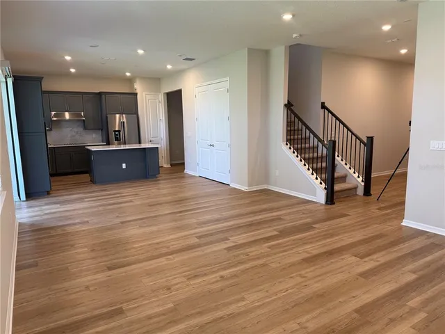 a view of kitchen and a wooden floor