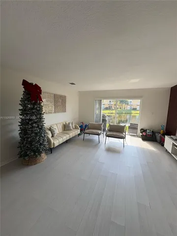 a room with furniture and a large window