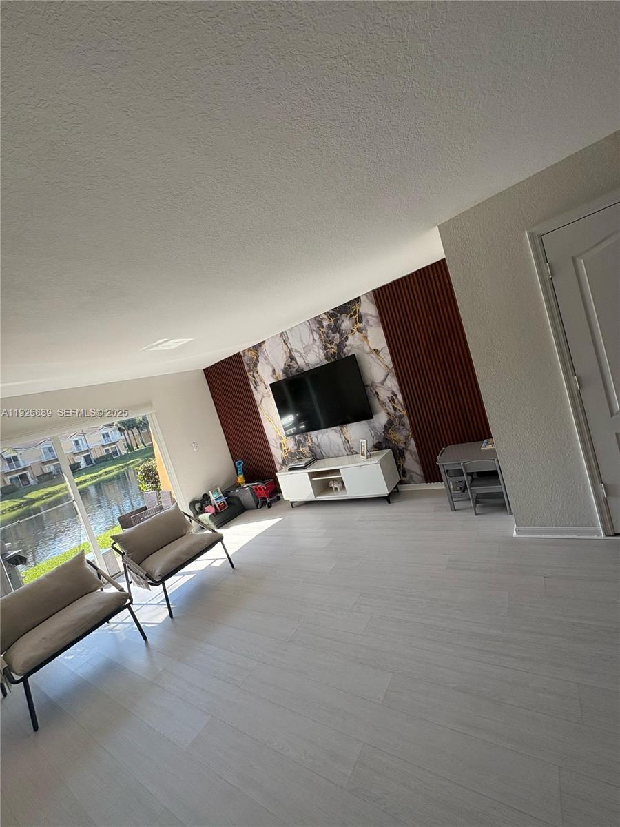 12842 Southwest 31st Street, Unit 134 Miramar, FL 33027 - Photo 13 of 30 a living room with furniture