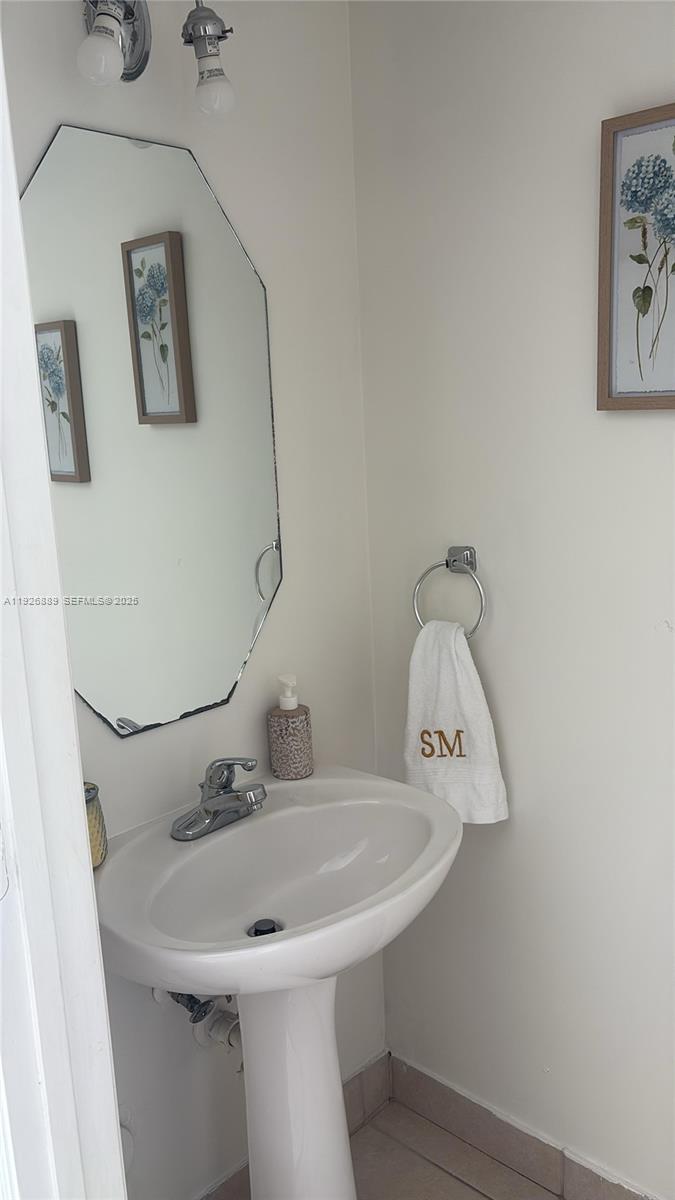 12842 Southwest 31st Street, Unit 134 Miramar, FL 33027 - Photo 15 of 30 a bathroom with a sink and mirror