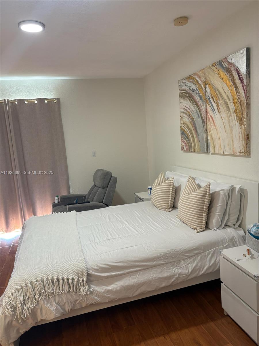 12842 Southwest 31st Street, Unit 134 Miramar, FL 33027 - Photo 18 of 30 a bedroom with a bed and a couch