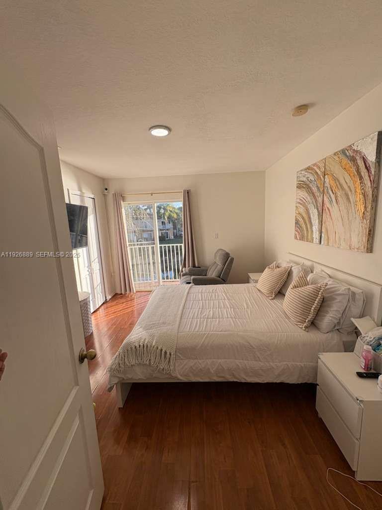 12842 Southwest 31st Street, Unit 134 Miramar, FL 33027 - Photo 19 of 30 a bedroom with a bed and a couch