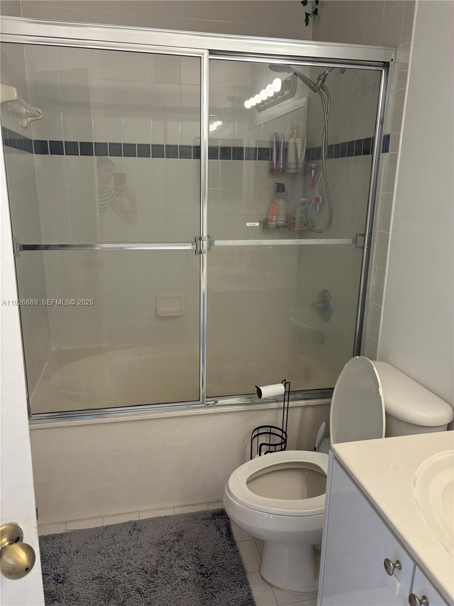 12842 Southwest 31st Street, Unit 134 Miramar, FL 33027 - Photo 22 of 30 a bathroom with a toilet and a shower