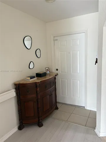 a view of cabinets and wooden floor