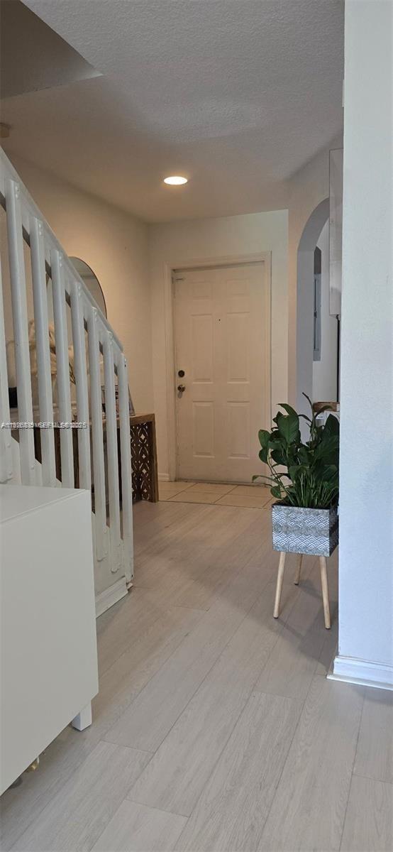 12842 Southwest 31st Street, Unit 134 Miramar, FL 33027 - Photo 5 of 30 a view of an entryway with wooden floor
