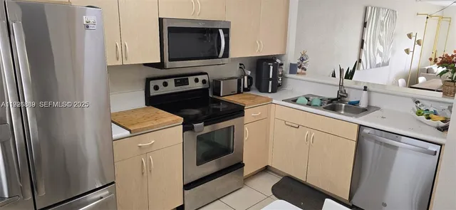 a kitchen with a stove microwave and sink