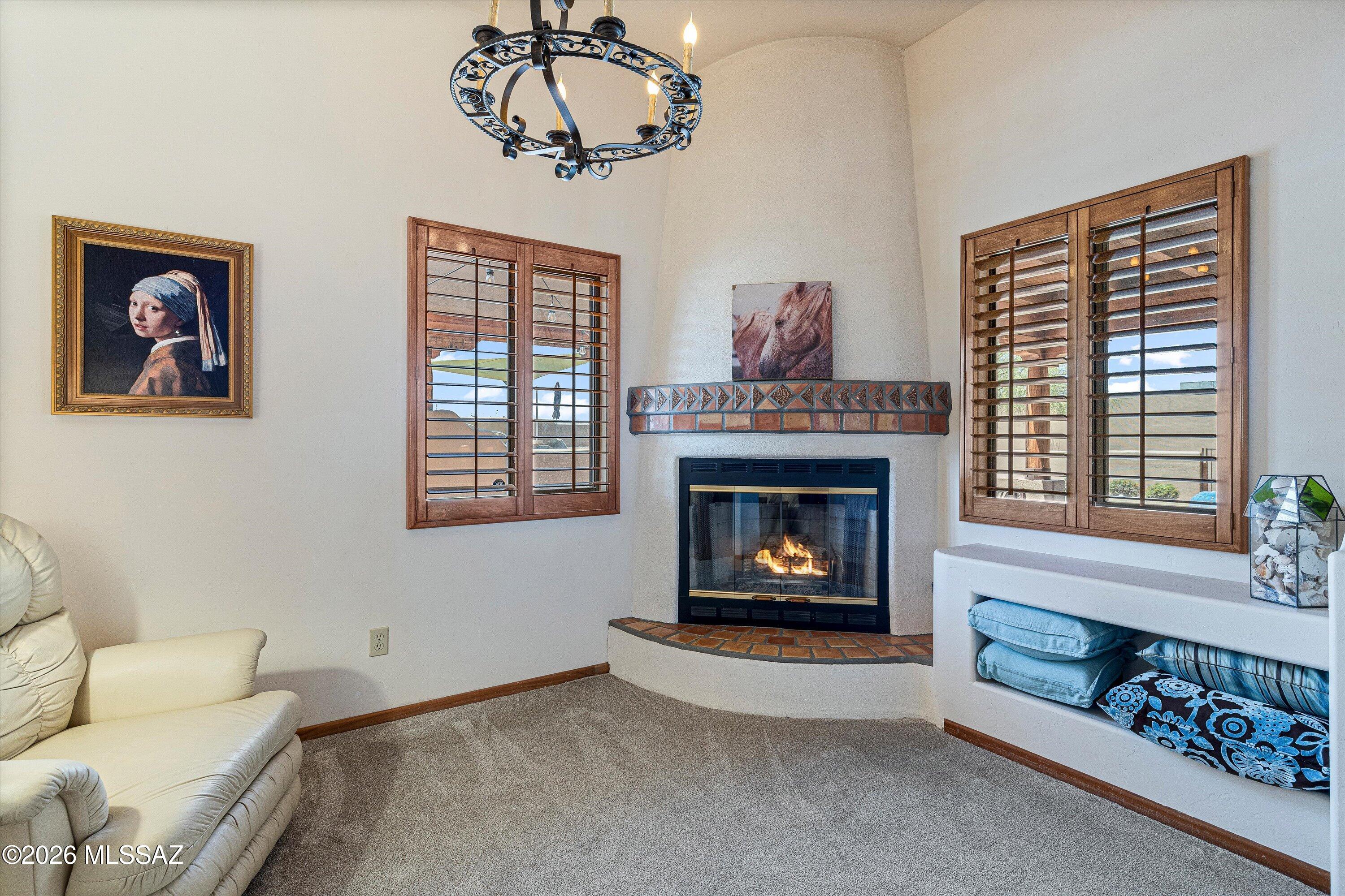 11160 East Golf Links Road Tucson, AZ 85730 - Photo 18 of 51 A cozy separate sitting area complete with another beehive fireplace and chandelier.