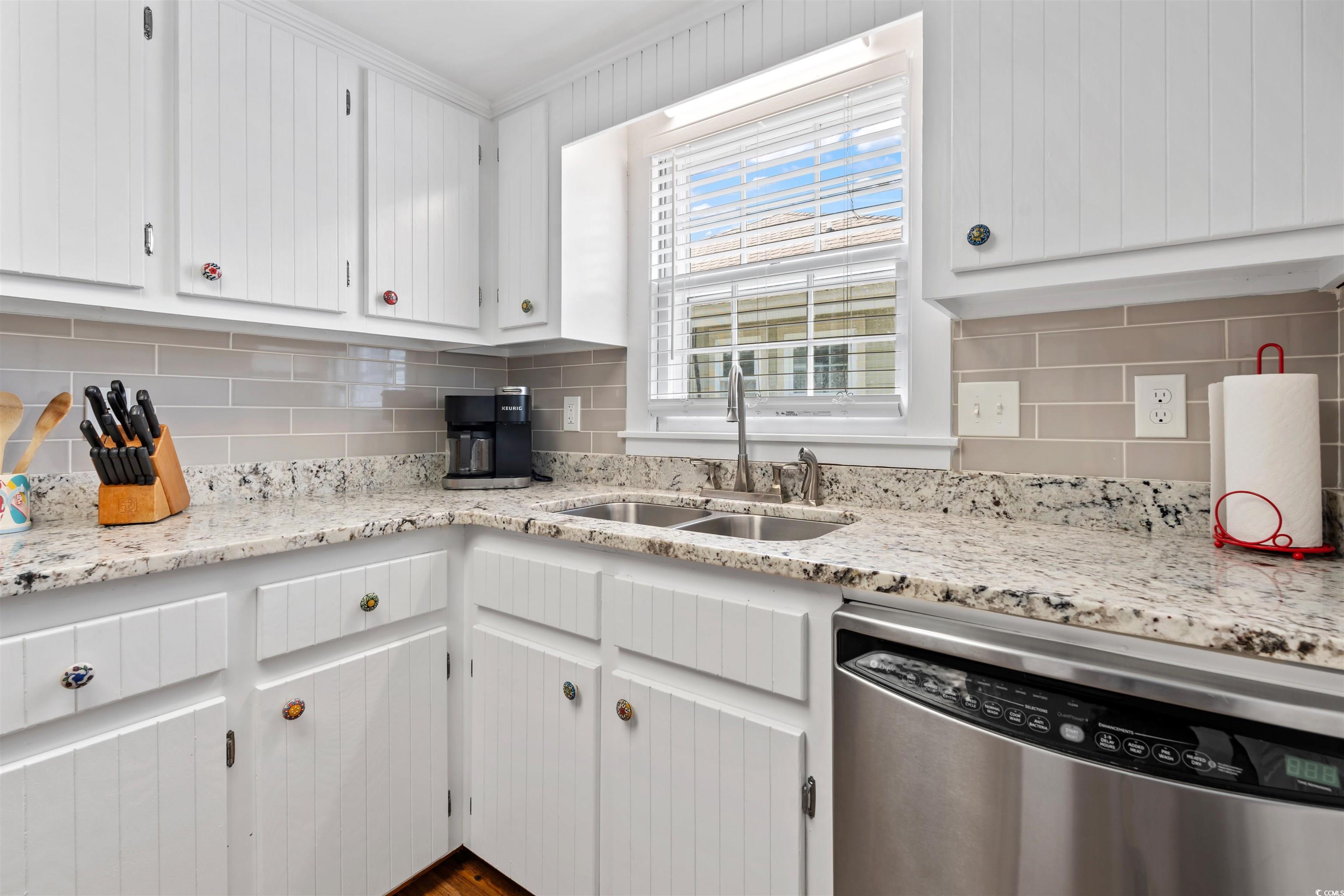 161 Easy Street Murrells Inlet, SC 29576 - Photo 21 of 40 Kitchen featuring stainless steel dishwasher, a sink, and tasteful backsplash