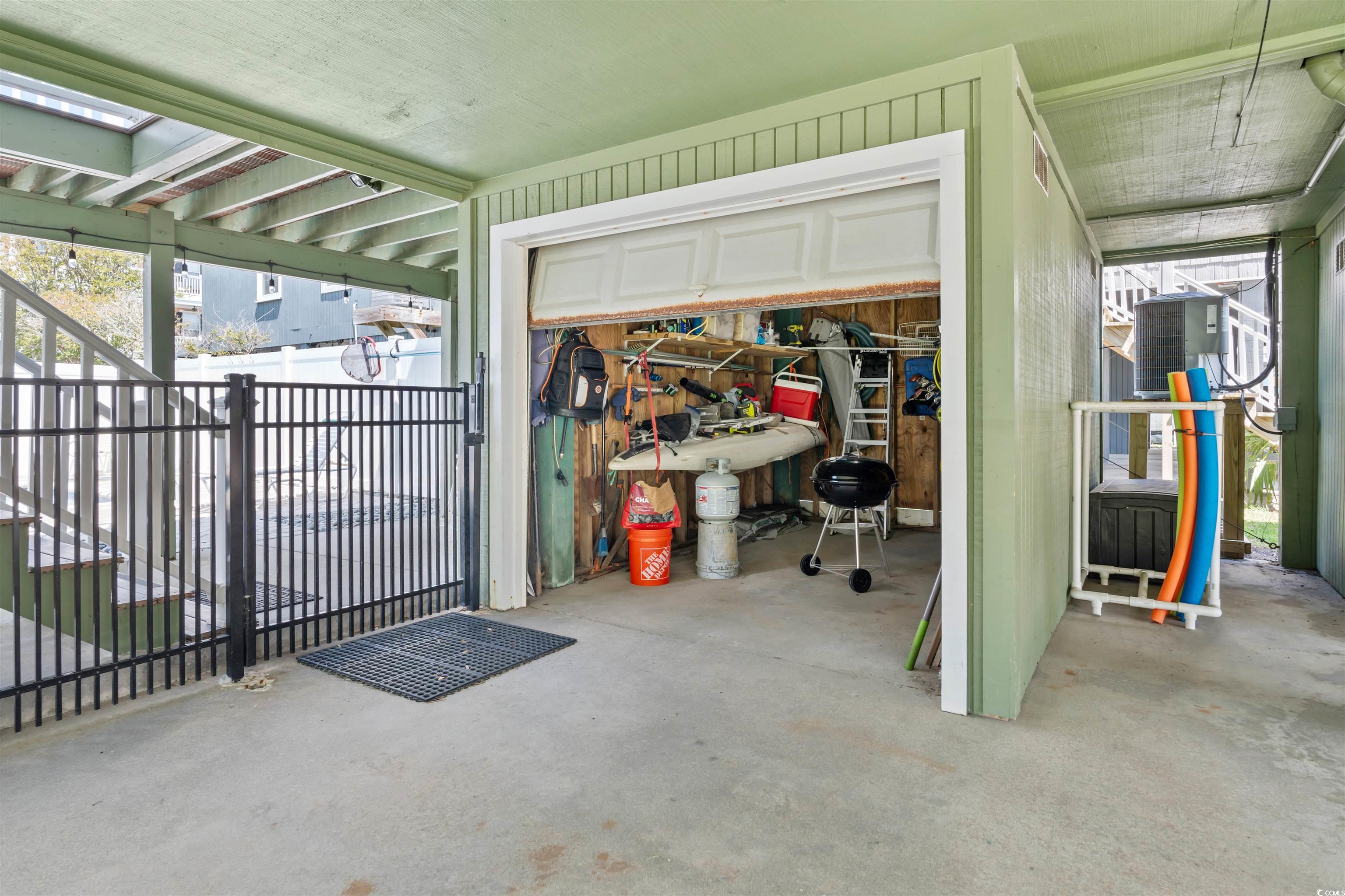 161 Easy Street Murrells Inlet, SC 29576 - Photo 28 of 40 Private Garage with roll down door easily houses golf cart and extra tools