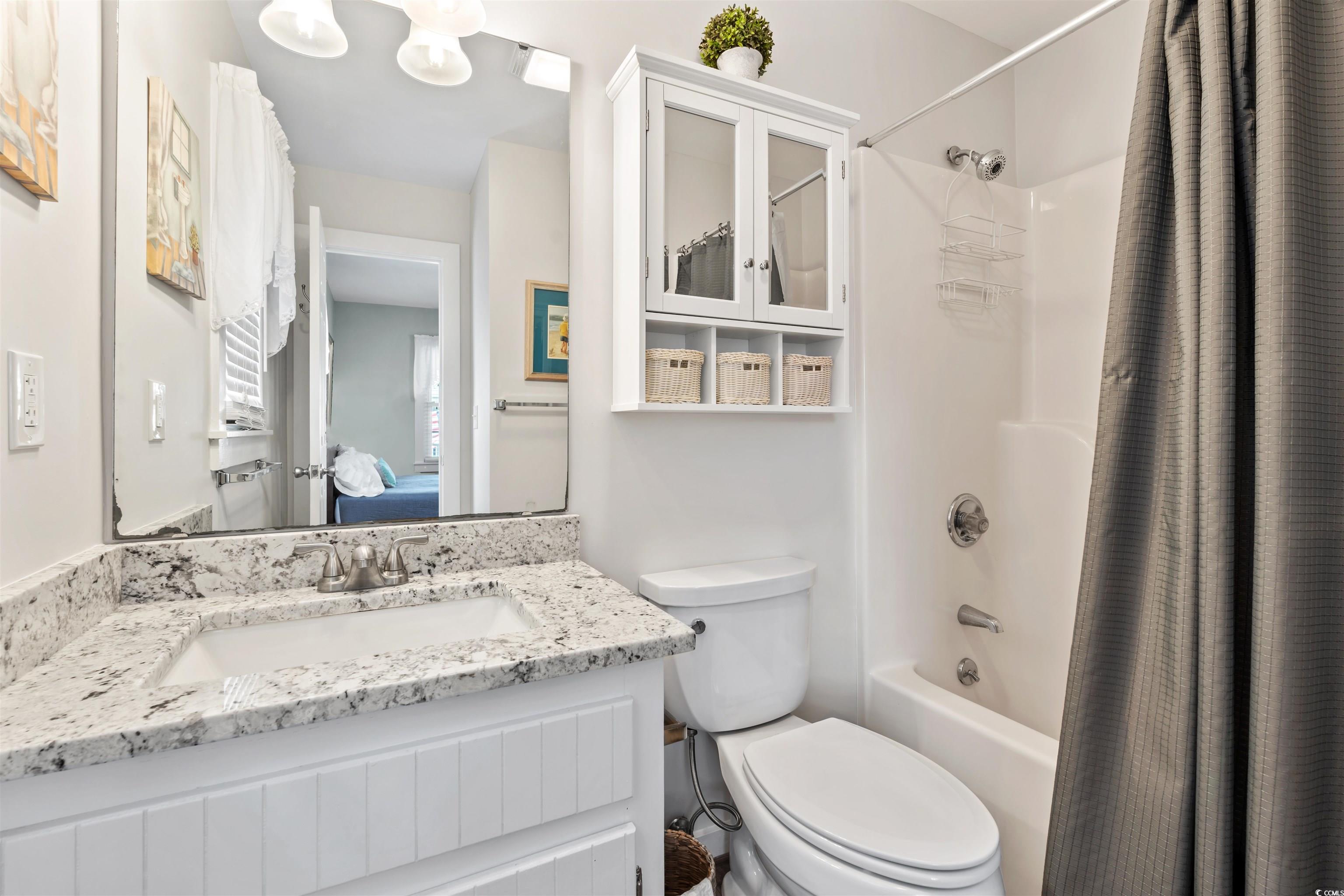 161 Easy Street Murrells Inlet, SC 29576 - Photo 8 of 40 Ensuite bathroom with shower / bathtub combination with curtain, vanity, and toilet