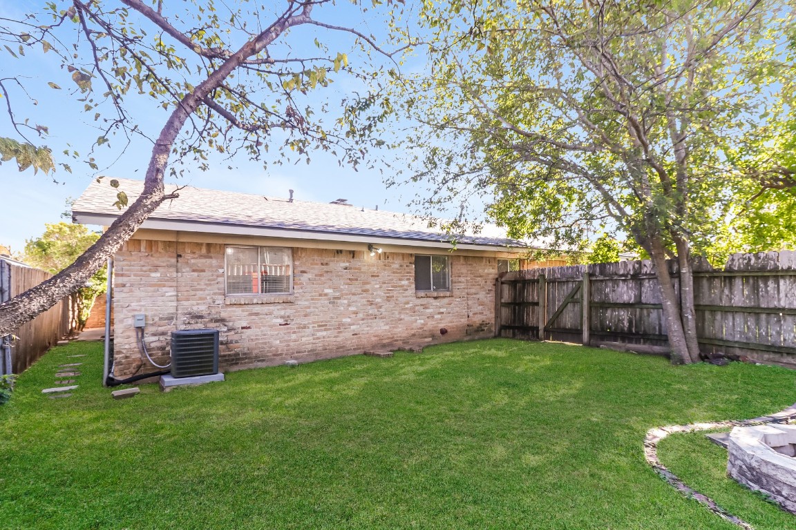 8116 Exmoor Drive, Unit B Austin, TX 78757 - Photo 15 of 15 a backyard of a house with lots of green space and wooden fence