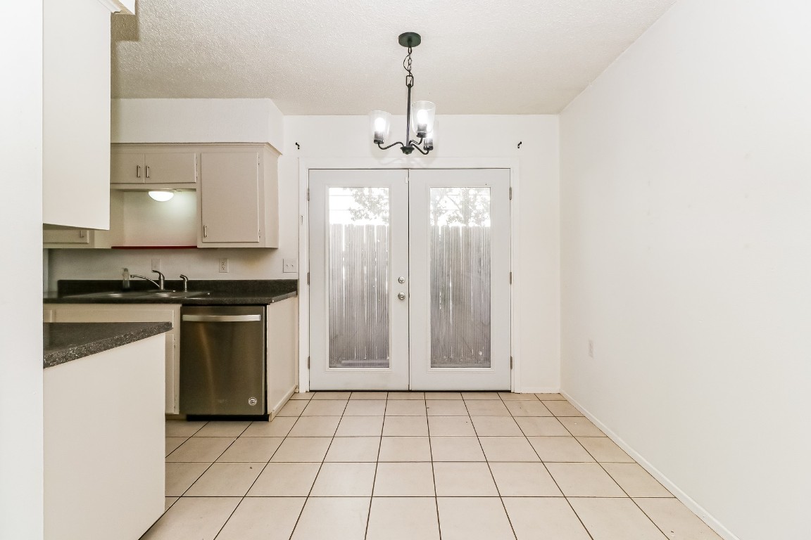 8116 Exmoor Drive, Unit B Austin, TX 78757 - Photo 6 of 15 a kitchen with a sink cabinets and appliances