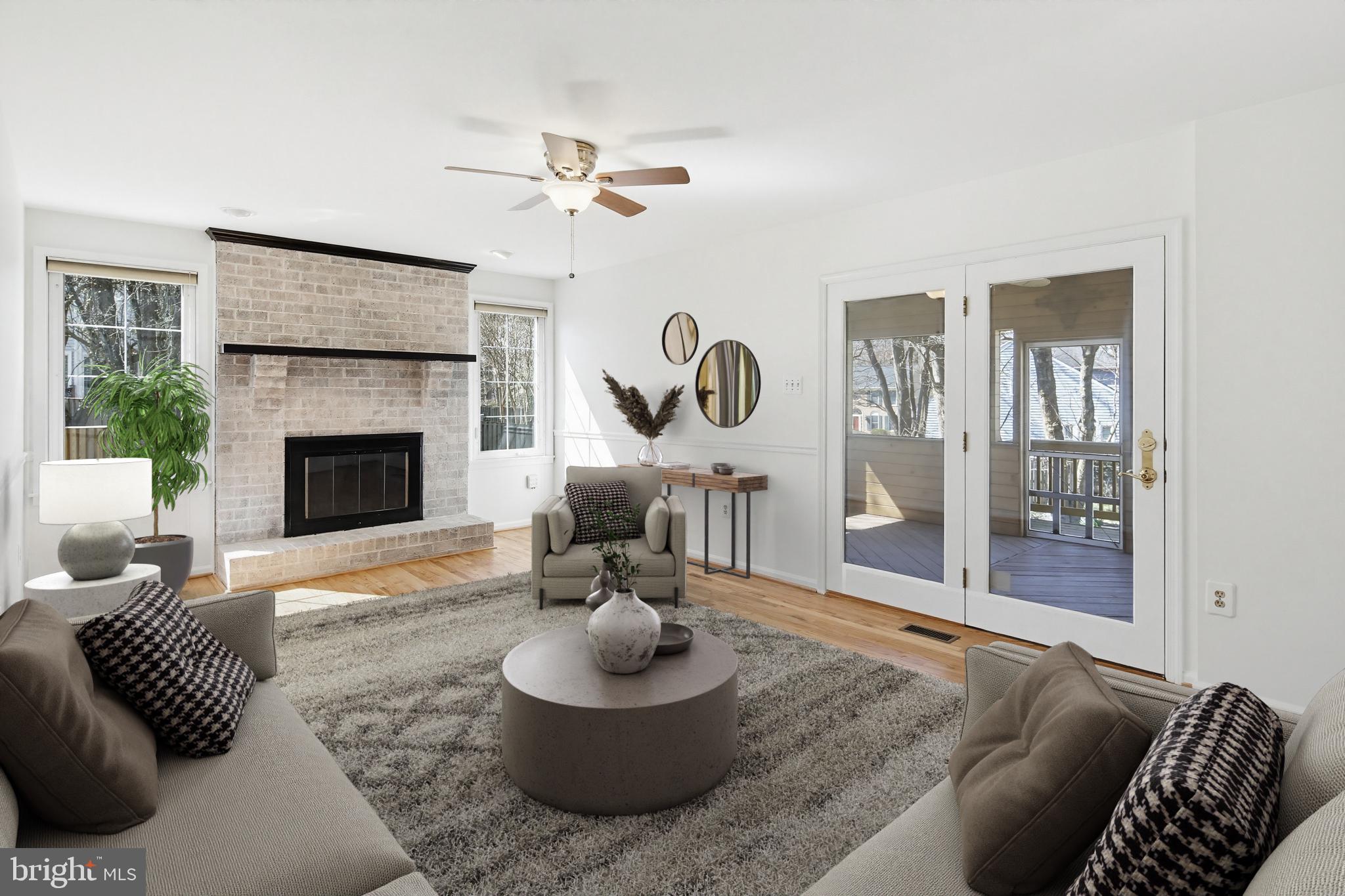8307 Spring Blossom Court Laurel, MD 20723 - Photo 21 of 69 a living room with furniture and a fireplace