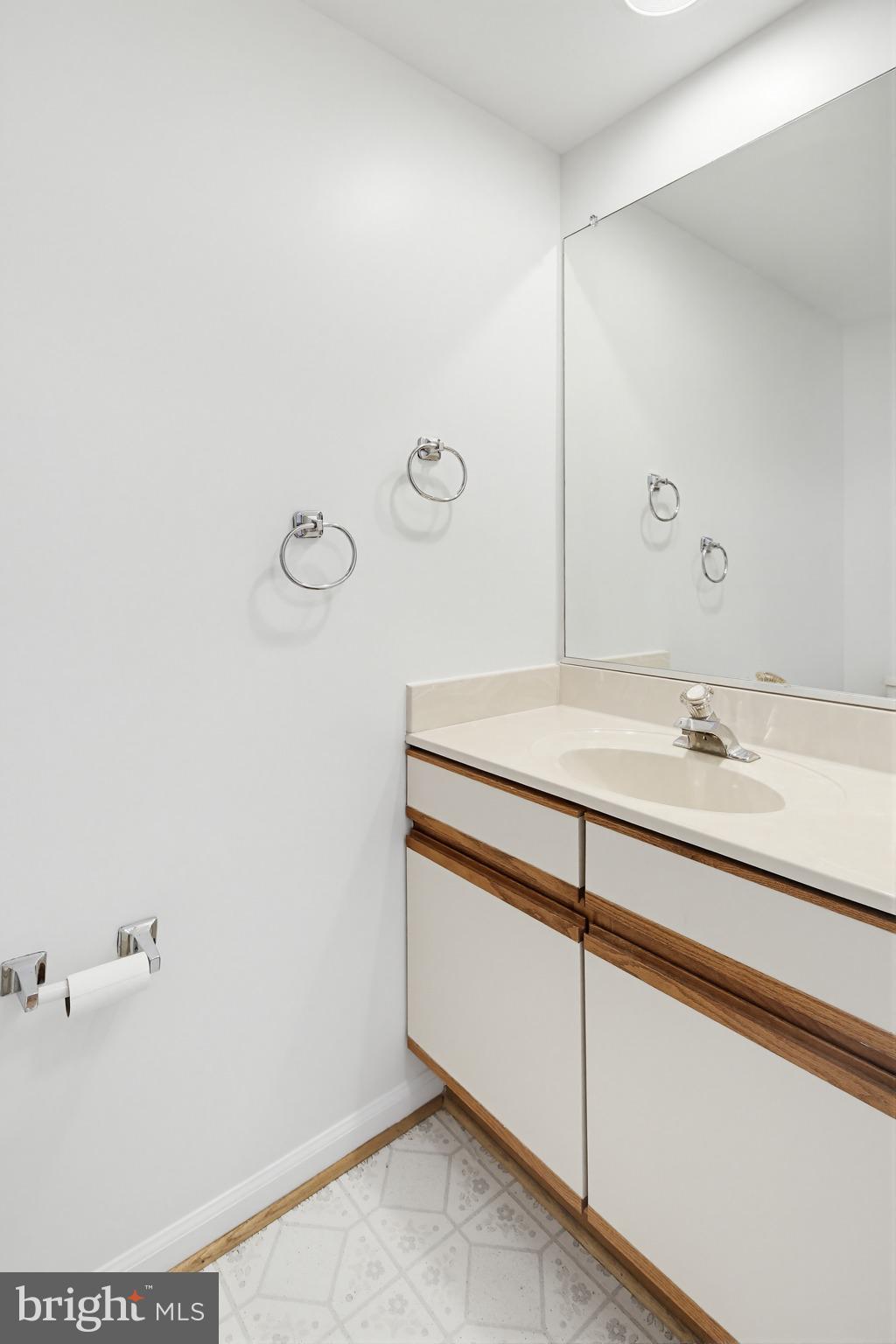 8307 Spring Blossom Court Laurel, MD 20723 - Photo 28 of 69 a bathroom with a sink and a mirror