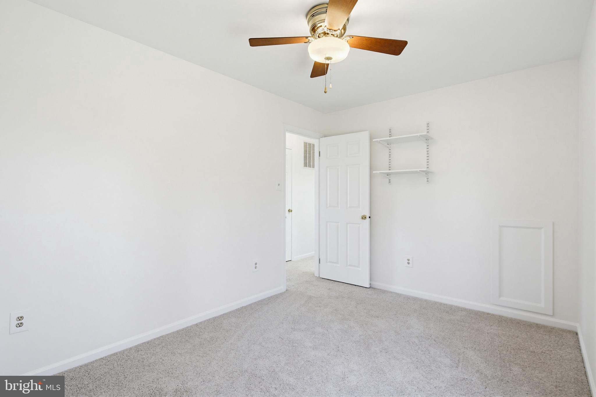 8307 Spring Blossom Court Laurel, MD 20723 - Photo 40 of 69 an empty room with a chandelier fan and closet