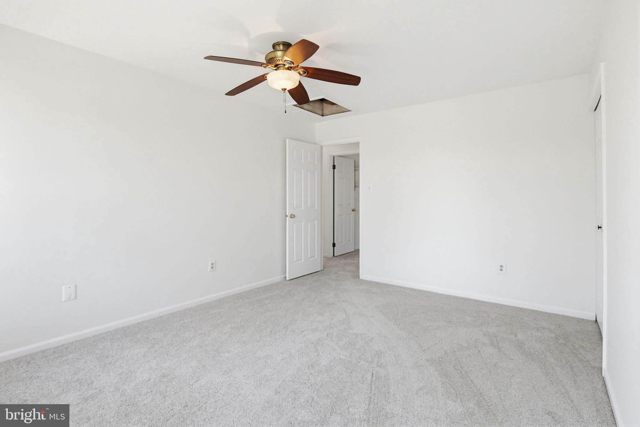 8307 Spring Blossom Court Laurel, MD 20723 - Photo 42 of 69 an empty room with a chandelier fan and a window
