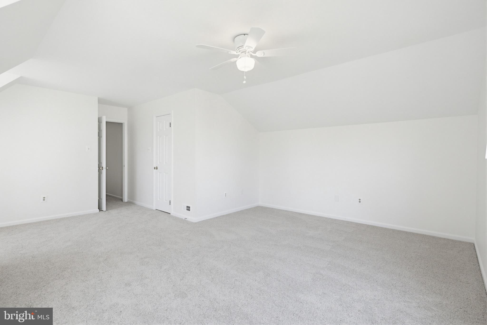 8307 Spring Blossom Court Laurel, MD 20723 - Photo 47 of 69 an empty room with an entryway and fan