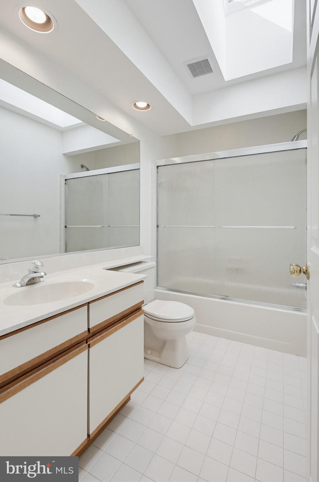 8307 Spring Blossom Court Laurel, MD 20723 - Photo 48 of 69 a bathroom with a sink a toilet and shower