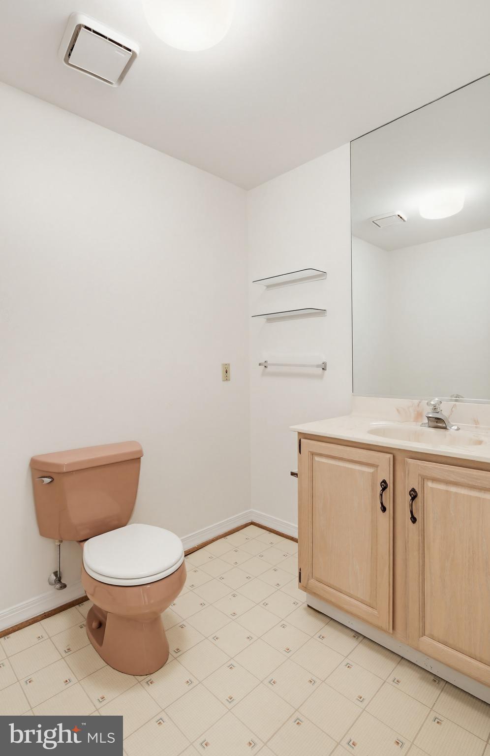 8307 Spring Blossom Court Laurel, MD 20723 - Photo 57 of 69 a bathroom with a granite countertop toilet and a sink