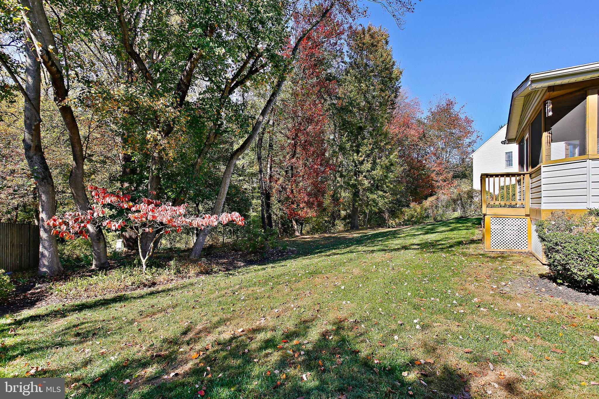 8307 Spring Blossom Court Laurel, MD 20723 - Photo 65 of 69 a view of a wooden house with a yard