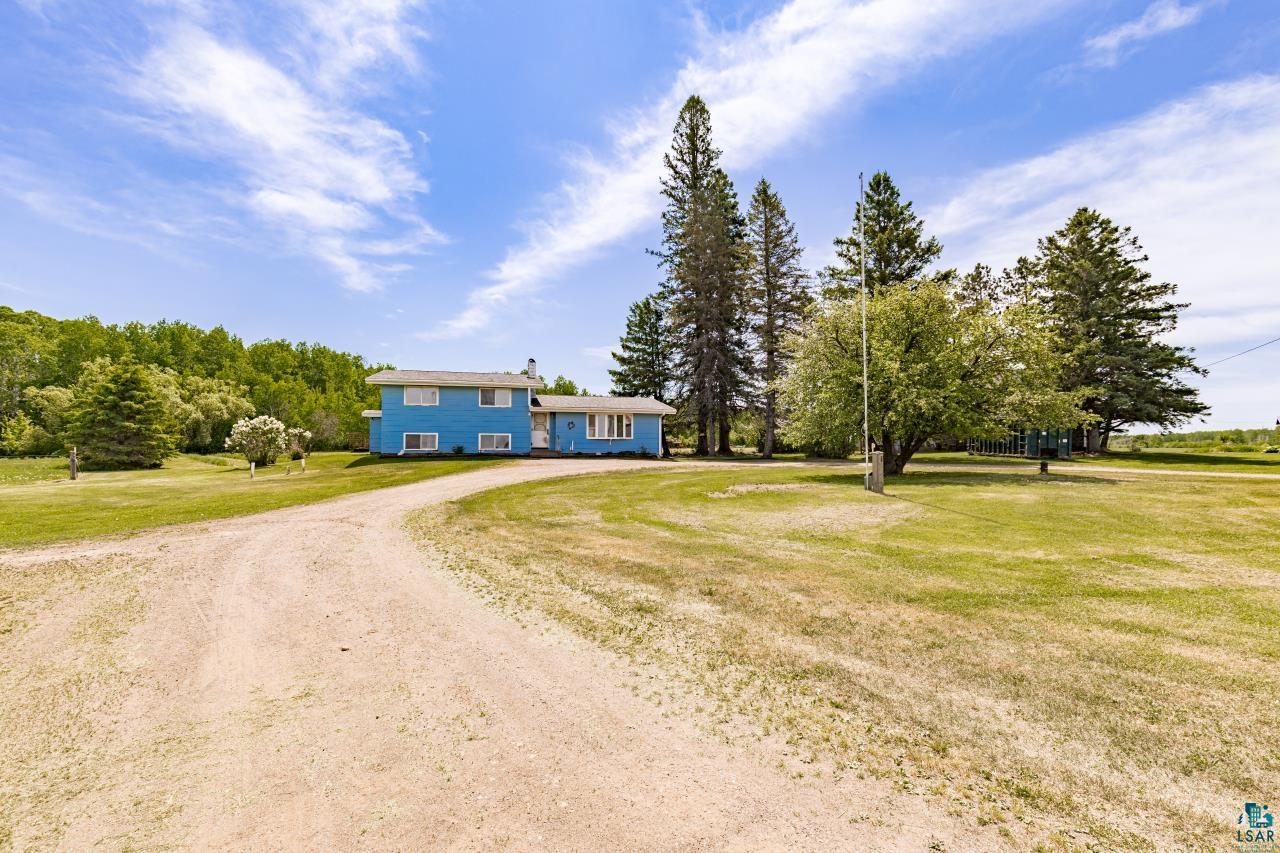 6606 Metso Road Kettle River, MN 55757 - Photo 73 of 84 Blue-sided home with white trim and multiple windows