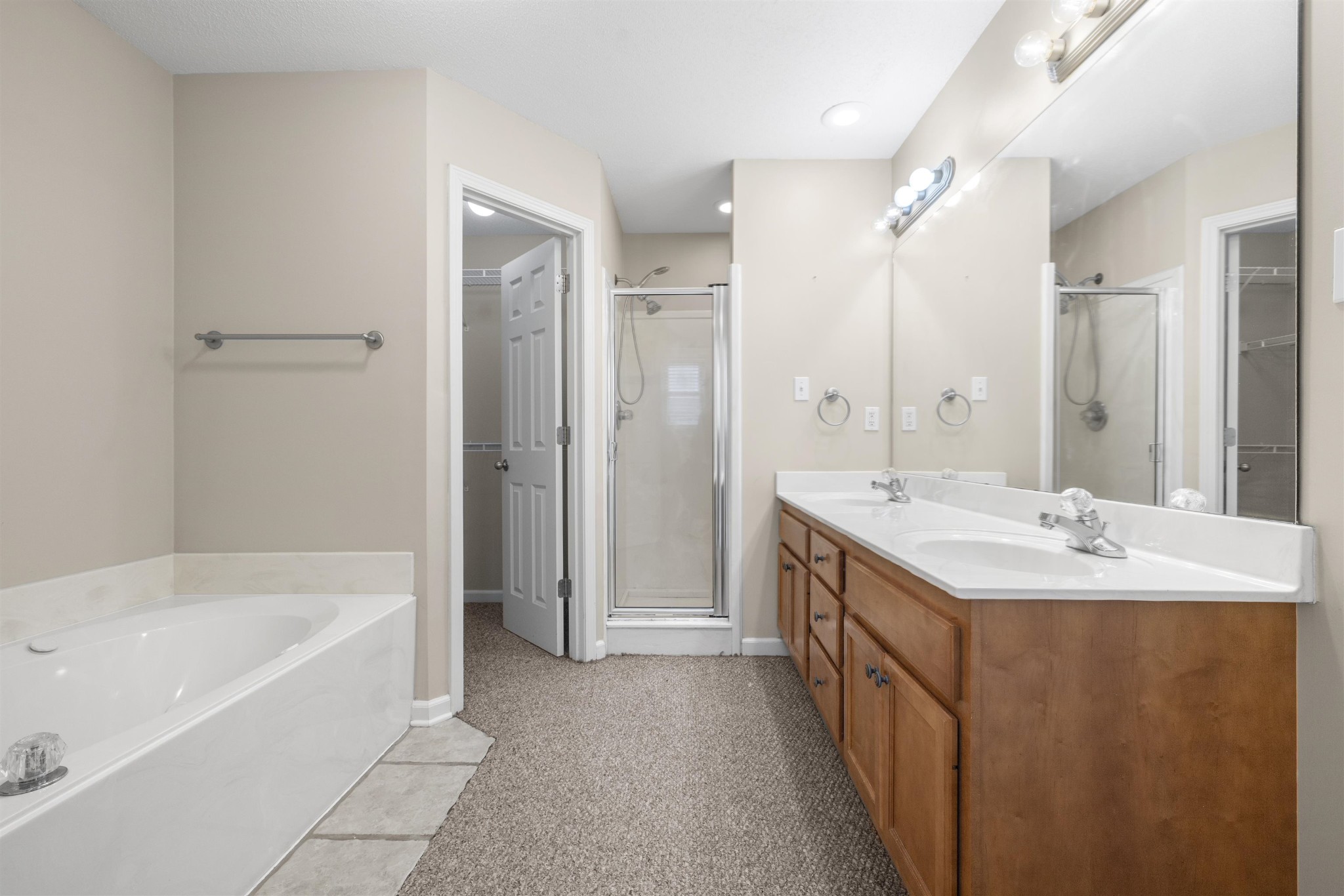 220 Terry Road Somerville, TN 38068 - Photo 18 of 29 a bathroom with a double vanity sink mirror double and bathtub