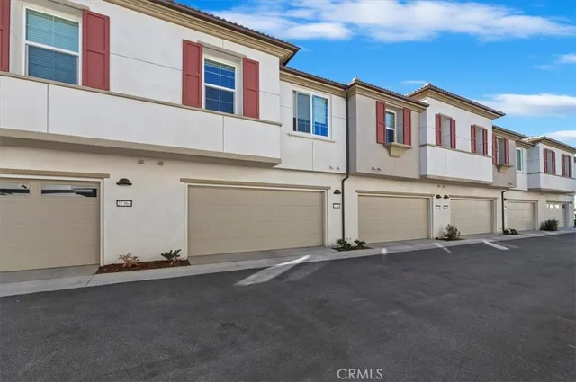 a view of a house with a street