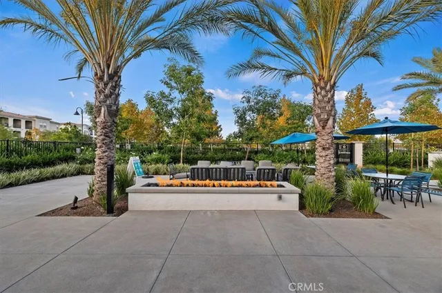 a wooden bench sitting in front of a building