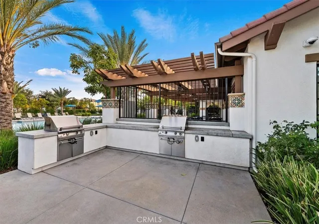 a view of a kitchen with a outdoor seating area