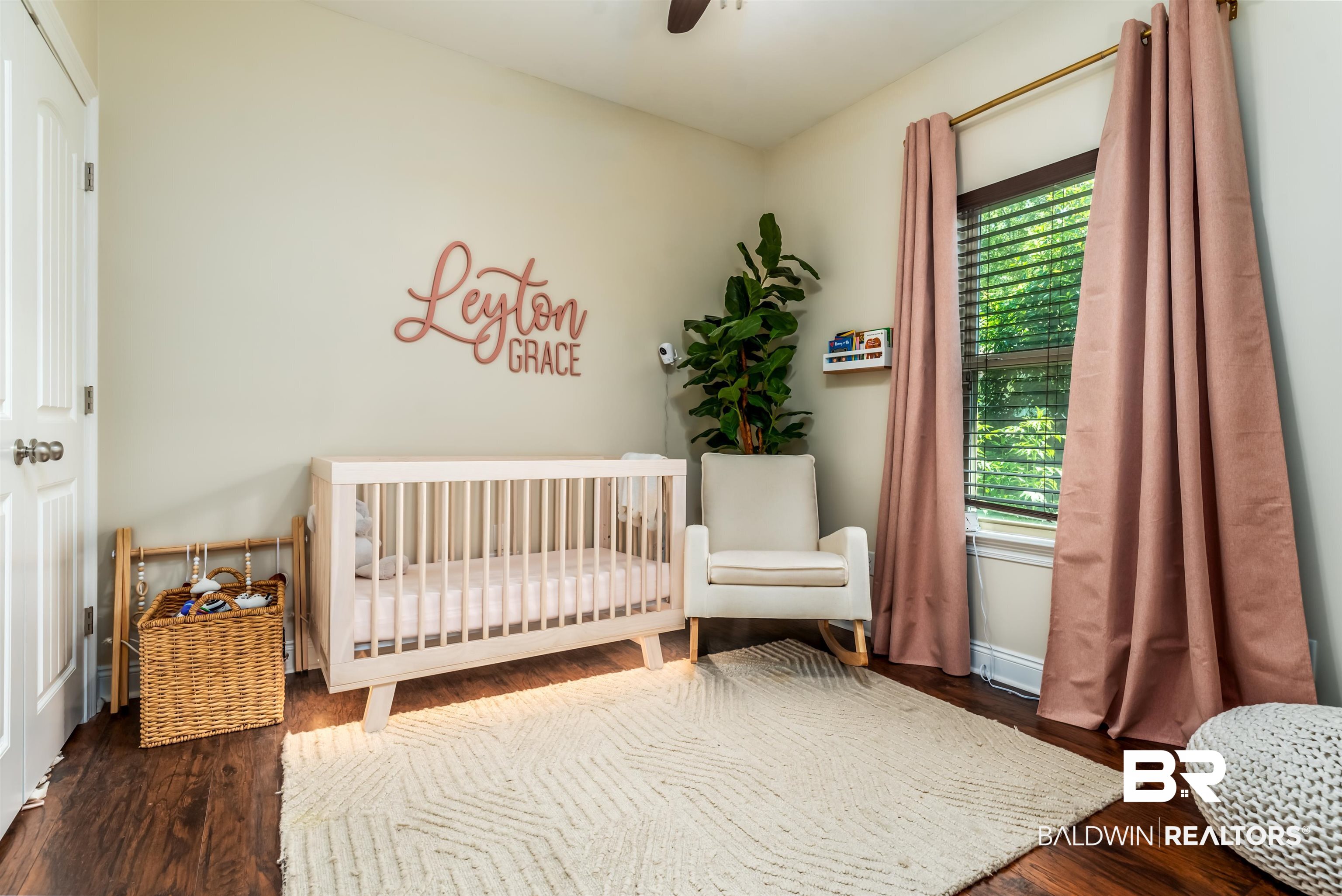 965 Henckley Avenue Mobile, AL 36609 - Photo 17 of 30 Bedroom featuring ceiling fan, a nursery area, and dark hardwood / wood-style flooring