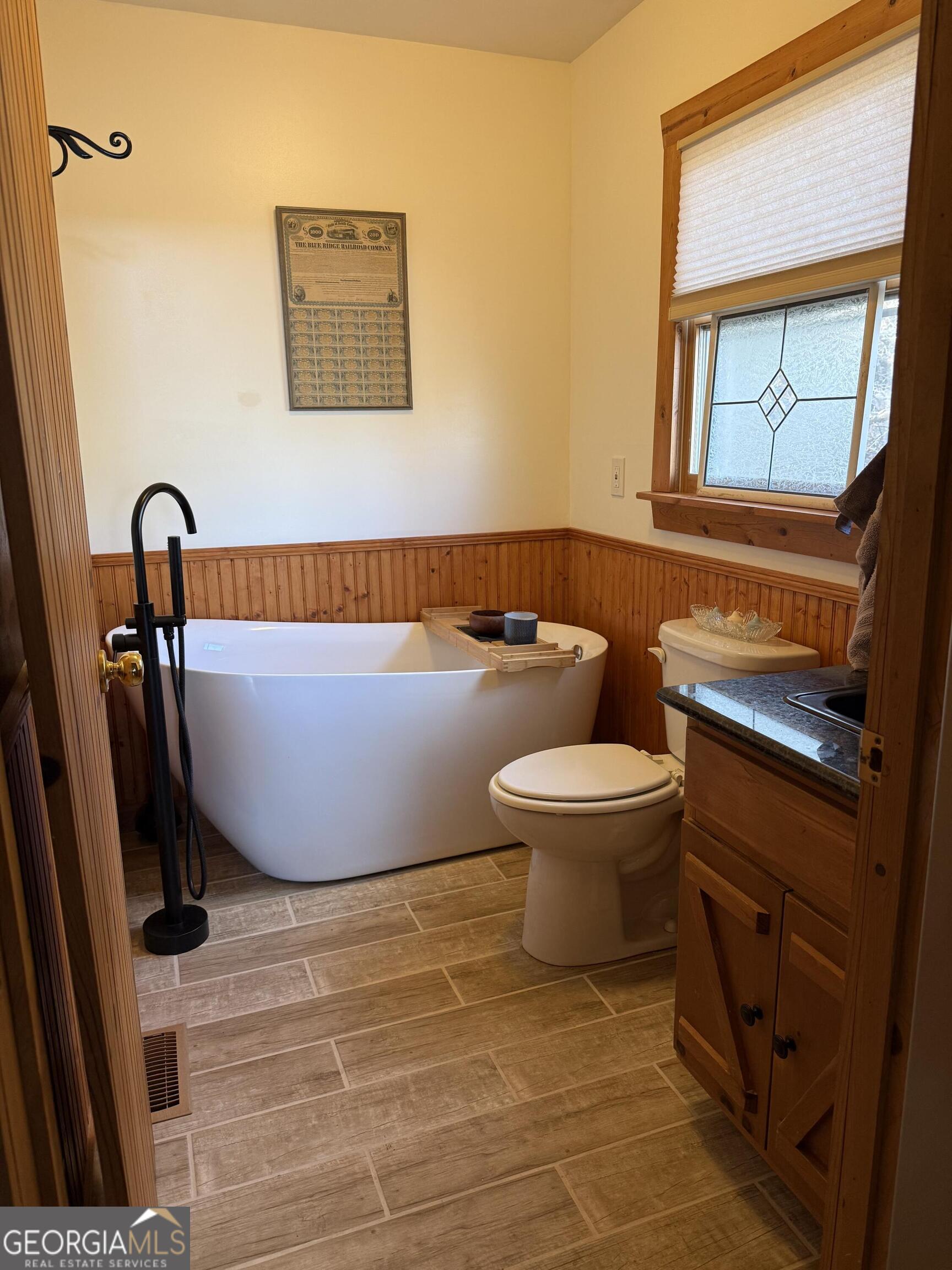 44 Cessna Lane Rabun Gap, GA 30568 - Photo 13 of 27 a bathroom with a toilet a sink and a mirror