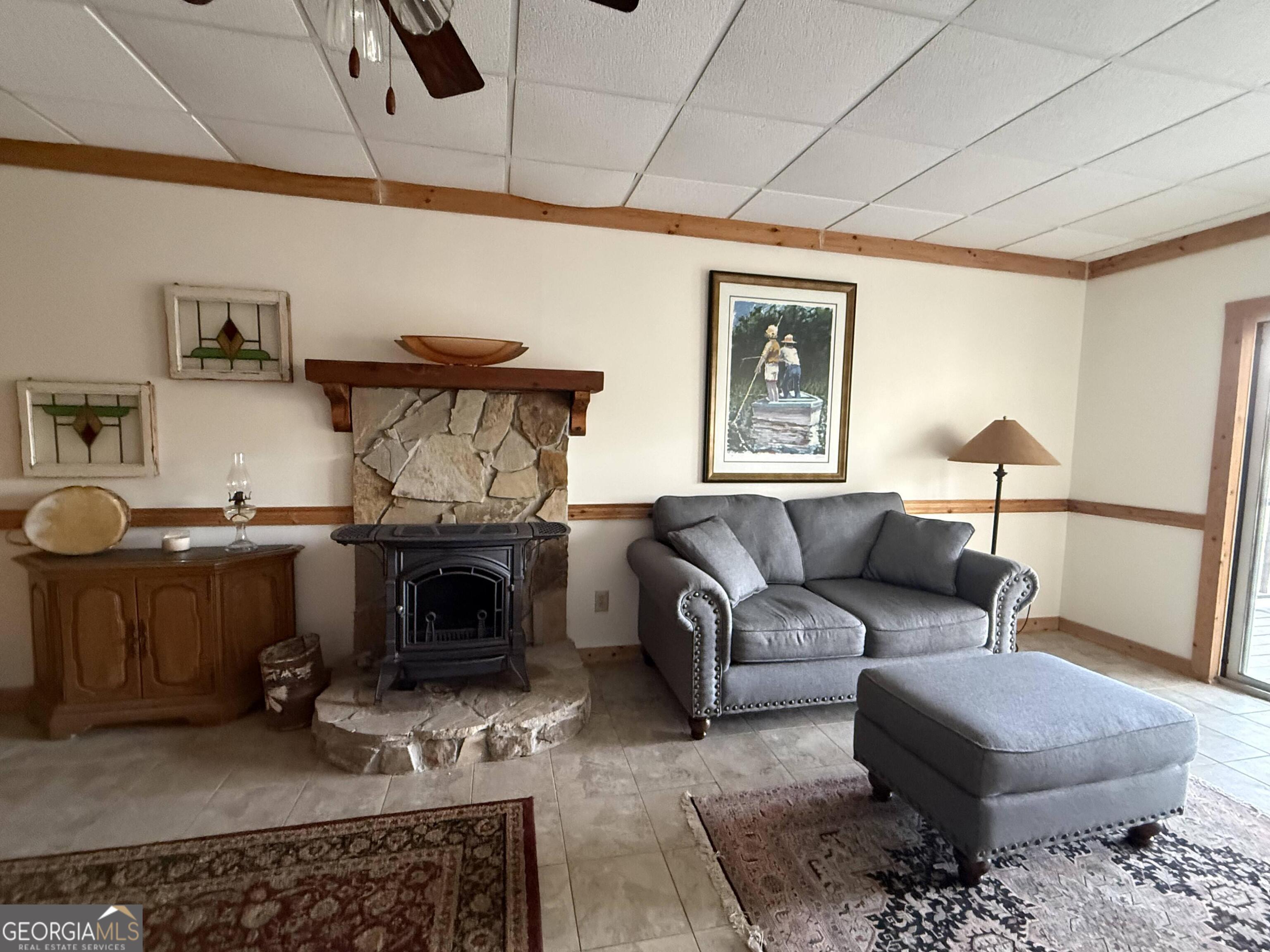 44 Cessna Lane Rabun Gap, GA 30568 - Photo 15 of 27 a living room with furniture and a fireplace