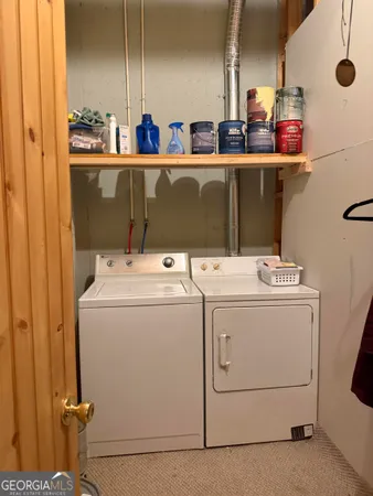 a view of a yard with plants and a trees