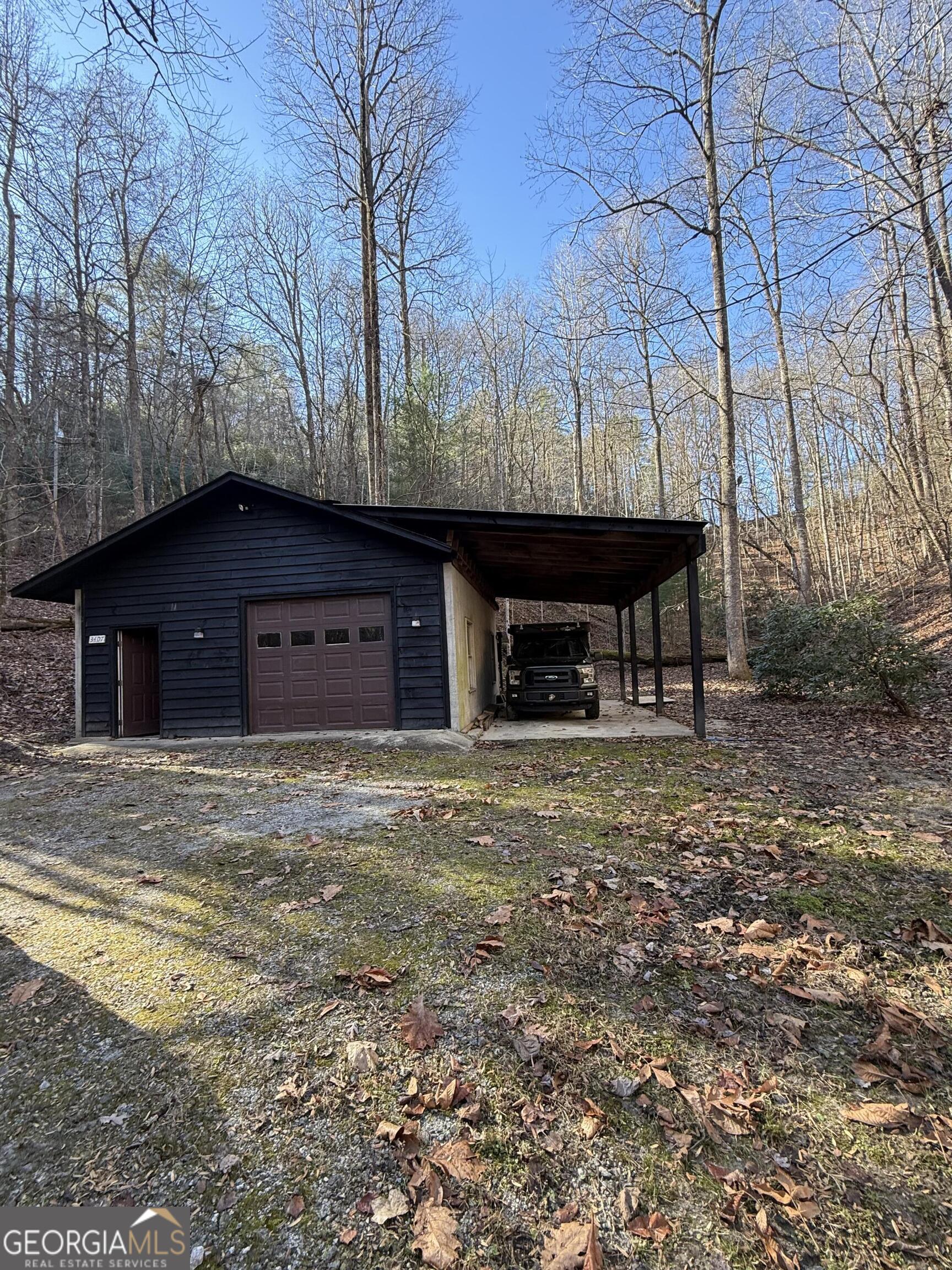 44 Cessna Lane Rabun Gap, GA 30568 - Photo 24 of 27 a front view of a house with a yard